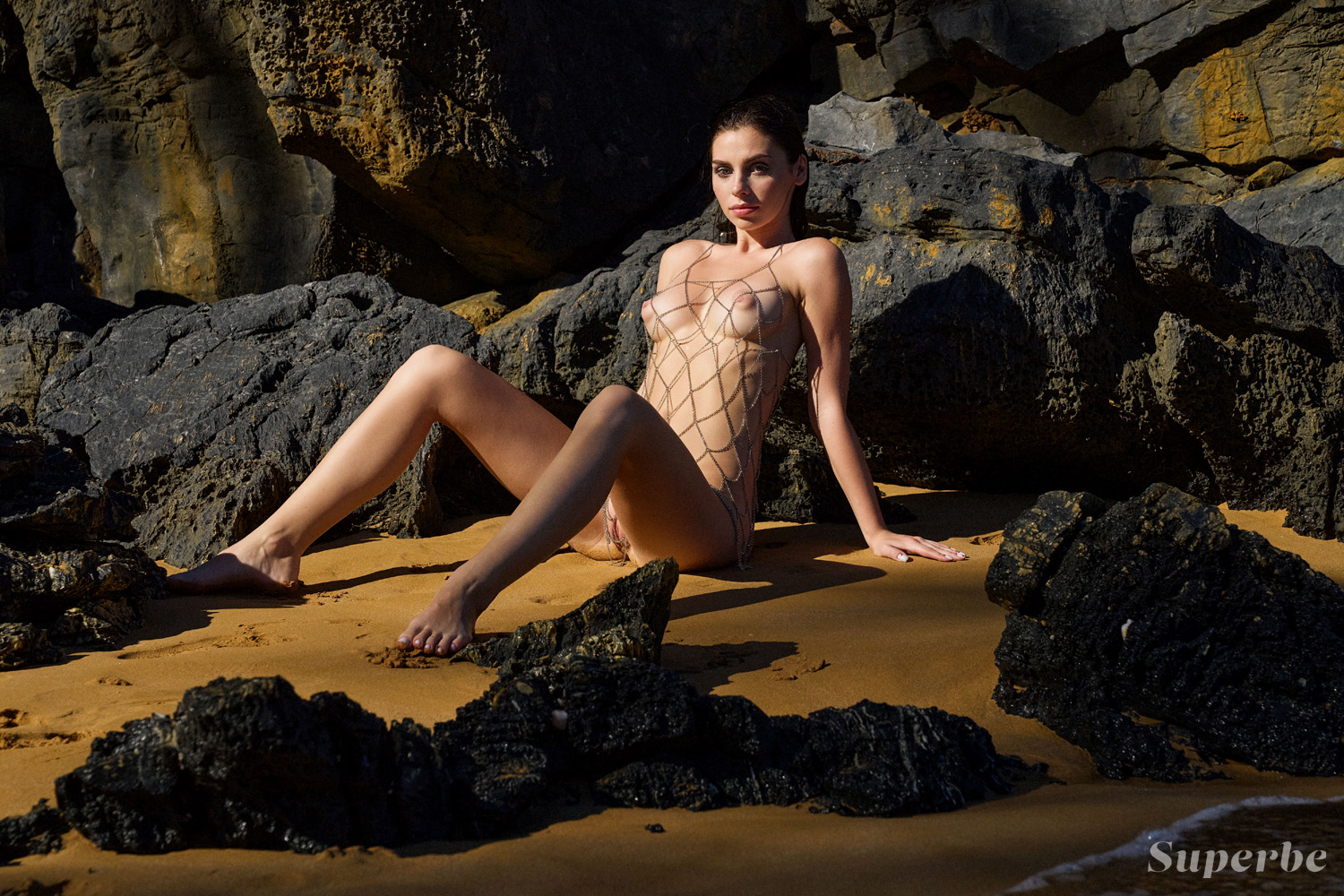 Irina Sivalnaya peels off her bathing suit on an exotic island