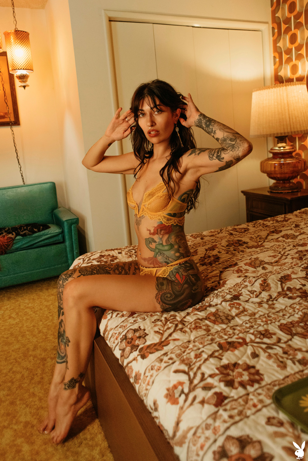 Dallas E Maxwell exposes her inked body in the motel room