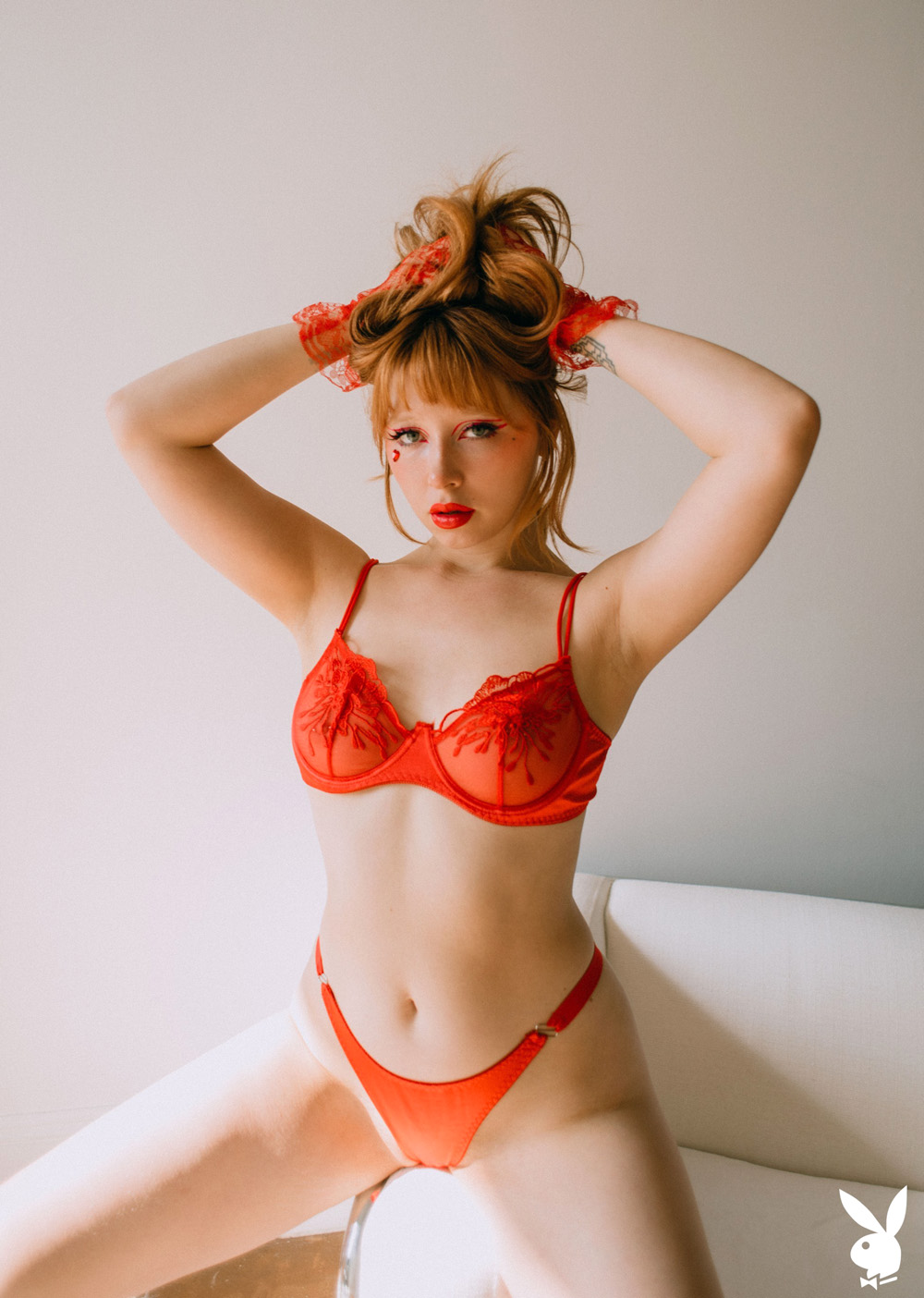 Eve Harper peels off her red lingerie in front of a mirror