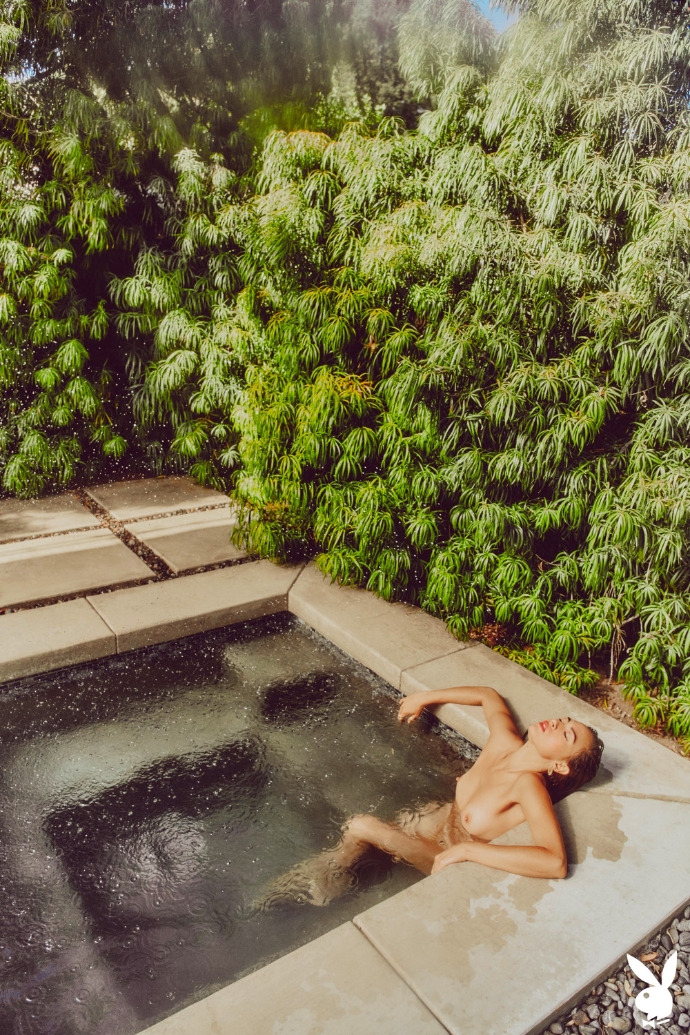 Genevieve Liberte skinny-dipping in the sun-drenched backyard