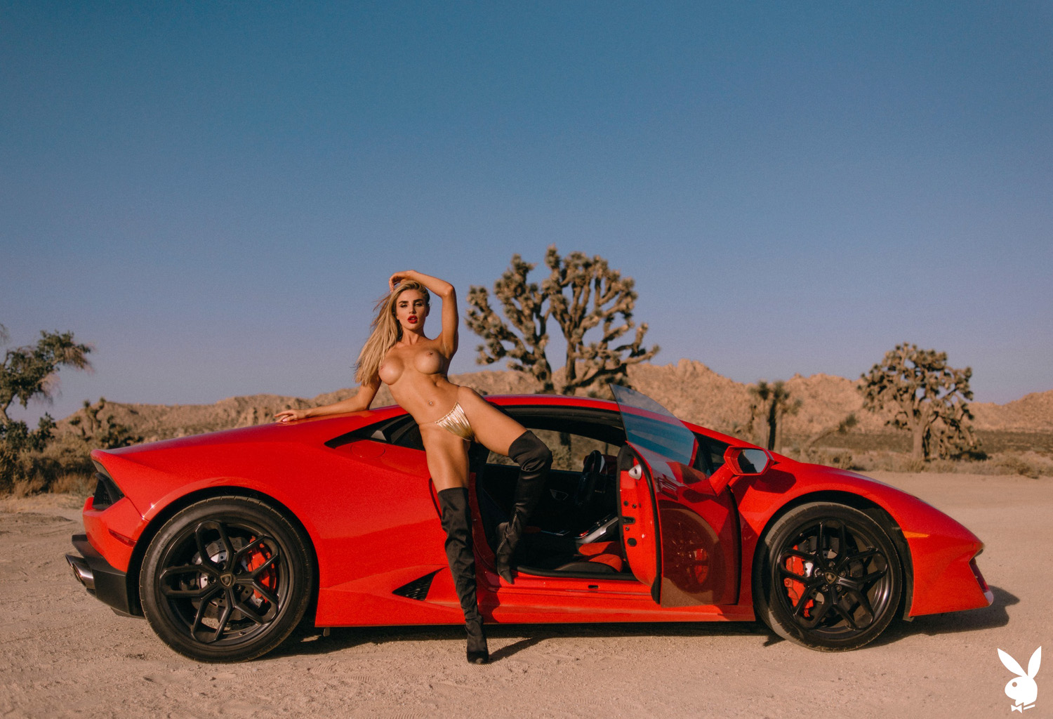 Kenzie Anne strips nude on top of an iconic red race car