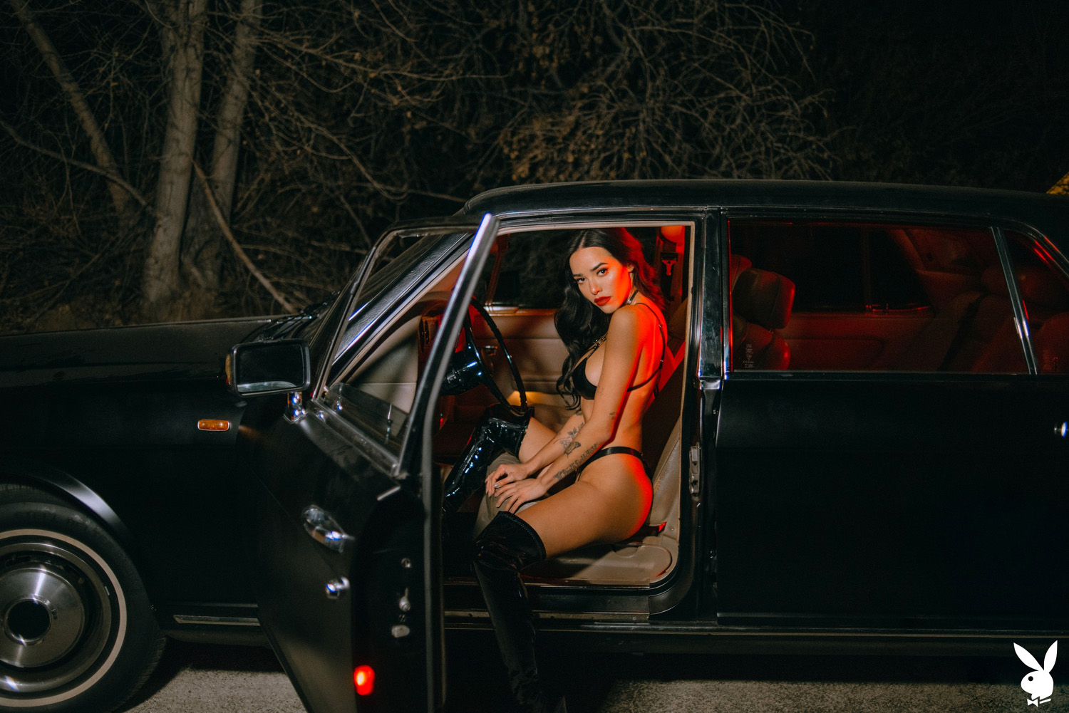 Lily Andrews goes for a late-night drive wearing high heeled latex boots