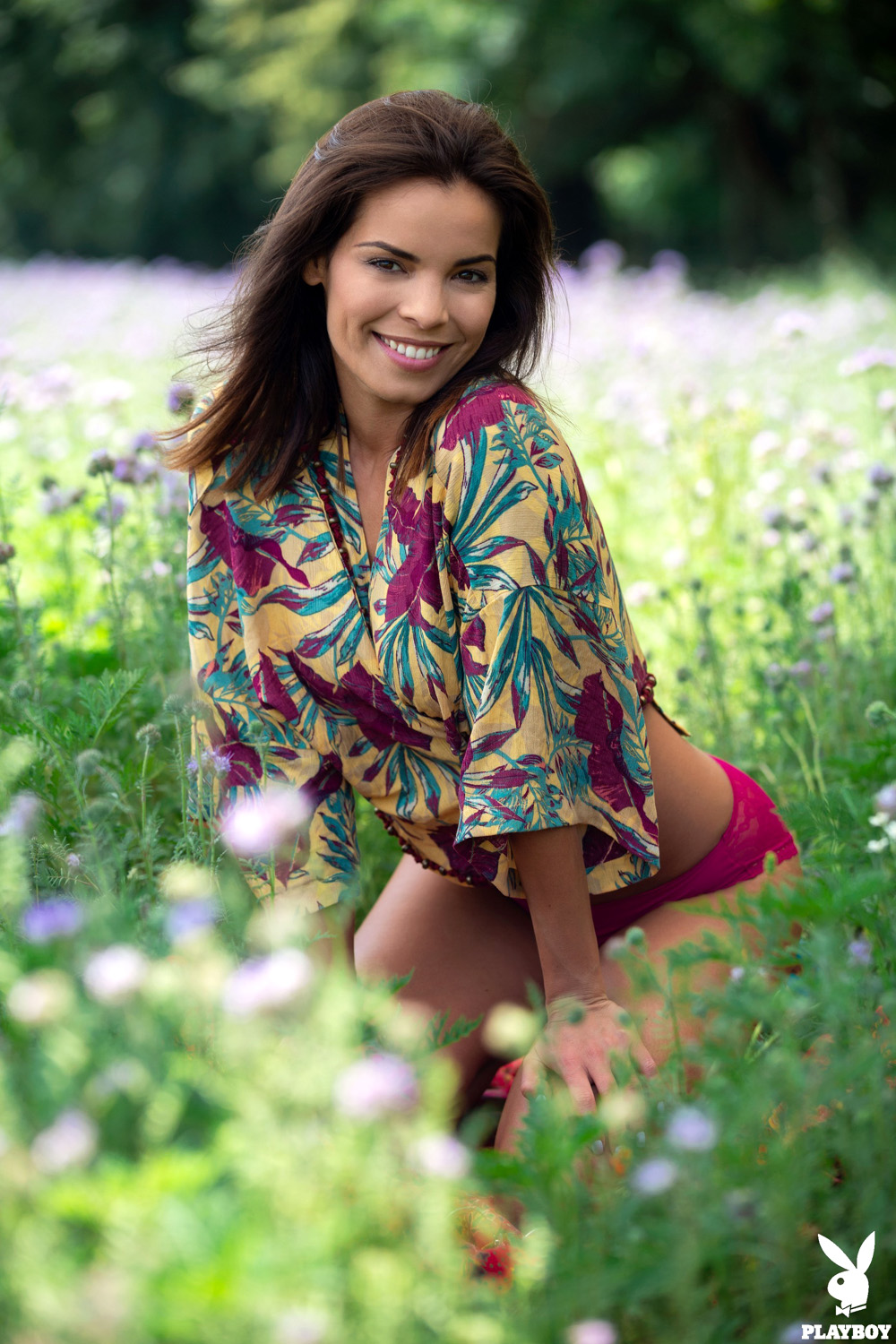 Natalie Costello exposes her perfect curves in a field of purple flowers
