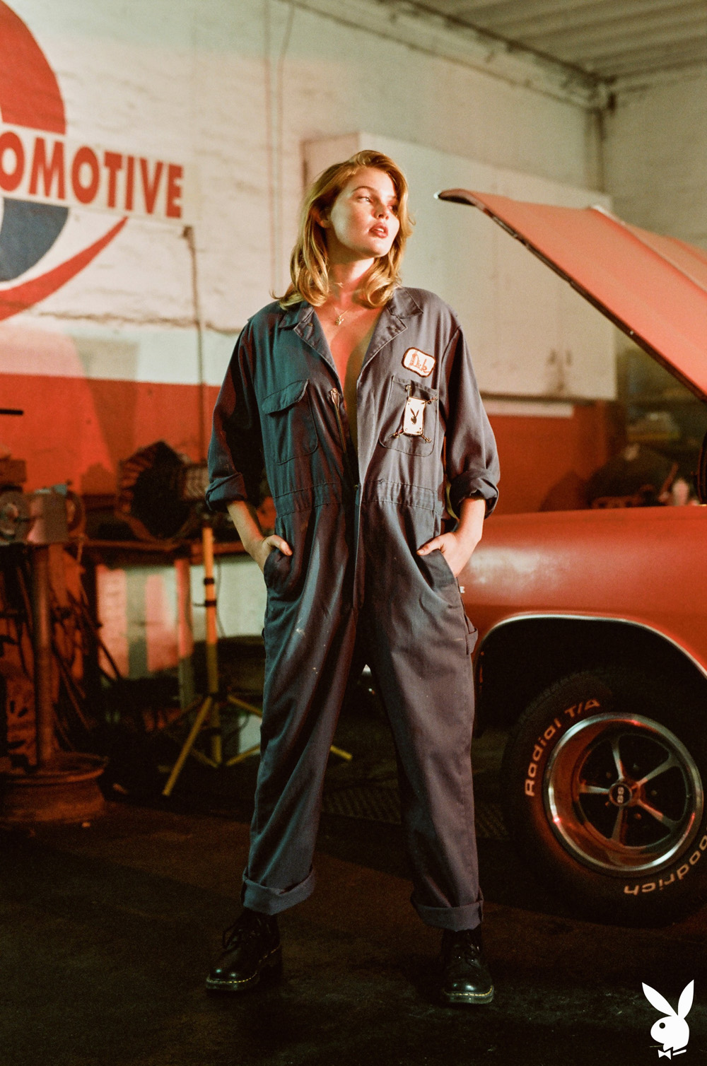 Savannah Smith sexy car mechanic stripping nude in the autobody shop
